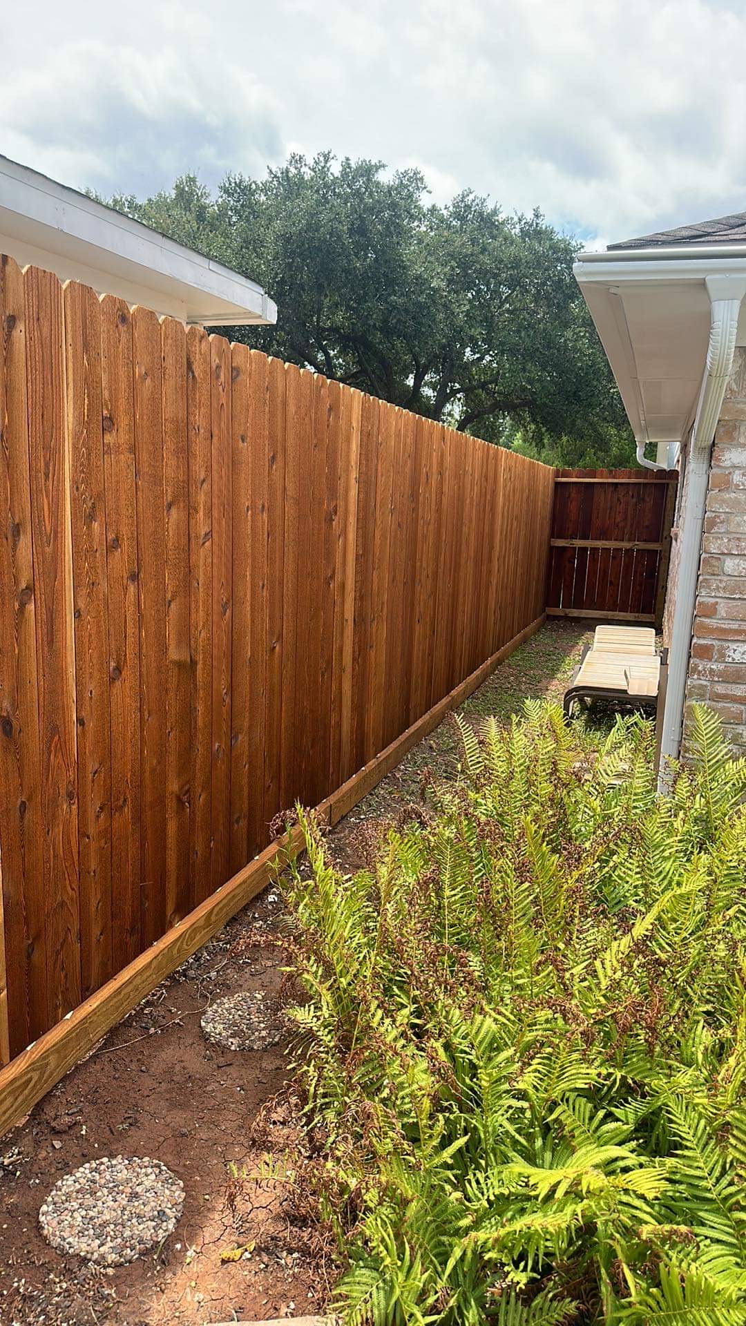 Freshly stained side-yard wood privacy fence and gate holding up in Houston weather — Jorge Torres Fence