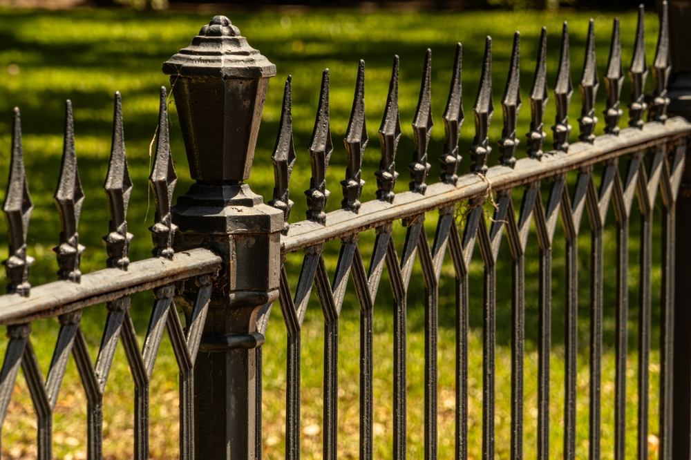 Bracket-Mounted Panels of a wrought iron fence